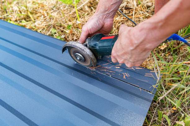 A person using a circular saw to cut a metal roofing sheet